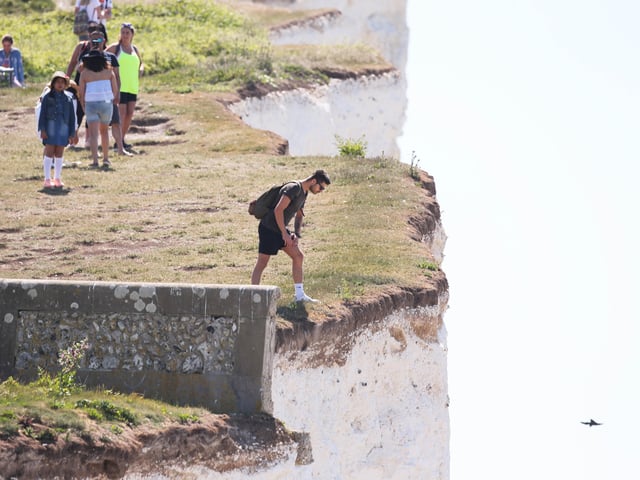 Large numbers of visitors were pictured at Birling Gap on Monday