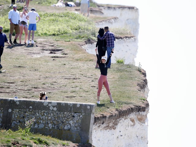 Large numbers of visitors were pictured at Birling Gap on Monday