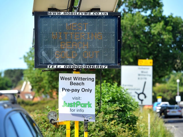 Signs warn visitors that tickets for the day are already fully booked