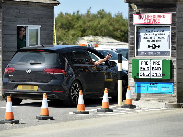 Signs warn of the new social distancing measures in place