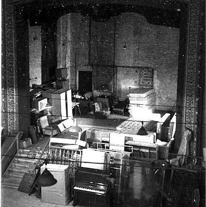 The stage during the period in the building's history when it was a furniture shop.