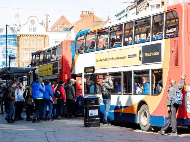 Bus passengers queuing in The Drapery during the early stages of lockdown