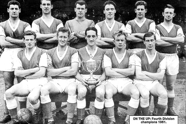 1960-61 FOURTH DIVISION TITLE WINNING SQUAD: Inducted: 7/3/2011. Won the title after scoring 134 goals in their first season in the Football League. The squad was (not all are pictured): Jack Walls, Jim Walker, Dick Whittaker, Jim Rayner, Norman Rigby, Keith Ripley, Billy Hails, Dennis Emery, Terry Bly, Ray Smith, Peter McNamee, Ellis Stafford, Ray Banham, Derek Norris, Ray Hogg.