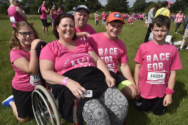 Race for Life 2019 at Ferry Meadows.   Julie Sugden with members of her family EMN-190630-165353009