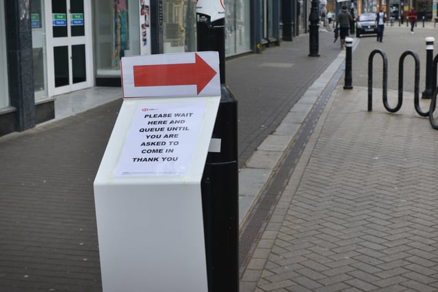 Social distancing signs and marking around Hastings town centre. SUS-200906-140129001
