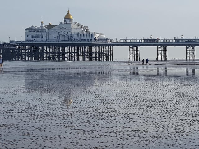 Eastbourne Pier at low tide, taken by Ann Collins with a Samsung S6 smartphone. SUS-200906-141209001