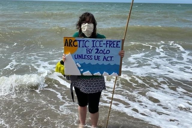 Members of Extinction Rebellion Lewes gather on Seaford beach to celebrate World Oceans Day