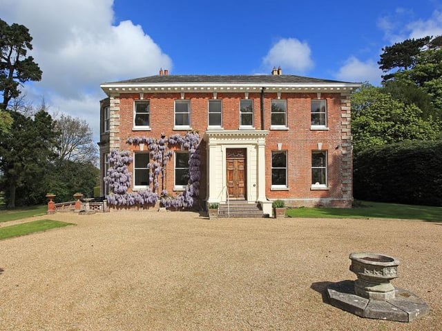 The long private driveway gives a wonderful first impression.