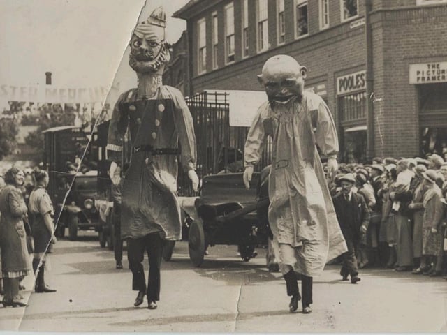 Members of the Harborough Fire Brigade as giants.