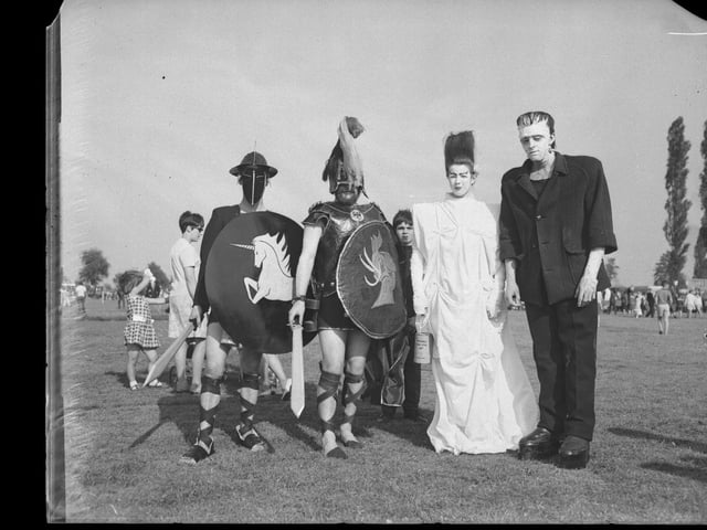 Early carnival participants in armour.