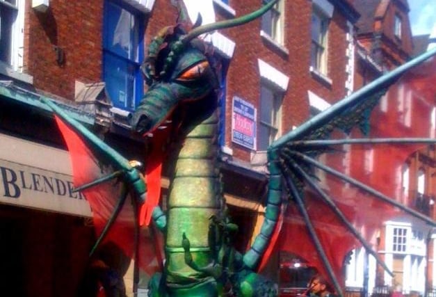 An impressive dragon roaming the streets.