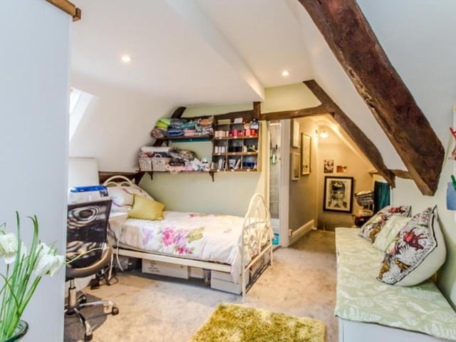 The top floor rooms feature original oak beams
