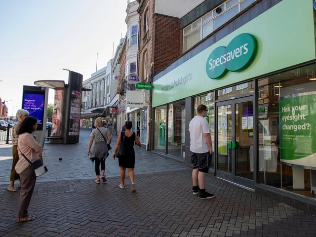 A queue also formed outside of Specsavers. Photo: Leila Coker.