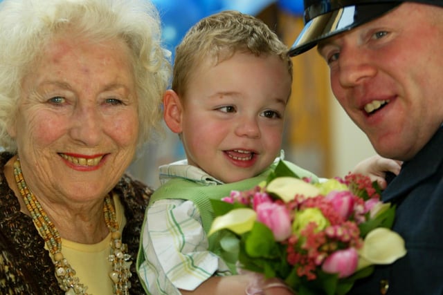 Dame Vera Lynn's 90th birthday at The School for Parents in Five Oaks. With Joshua Mills, aged 2, and his father Paul. Picture: Derek Martin Photography