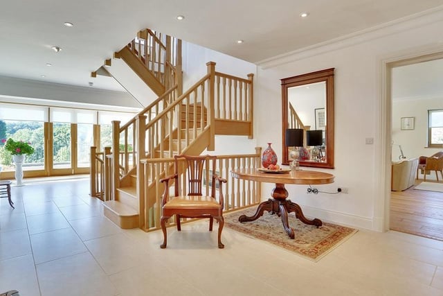 On the ground floor the grand wooden staircase creates a stunning focal point.