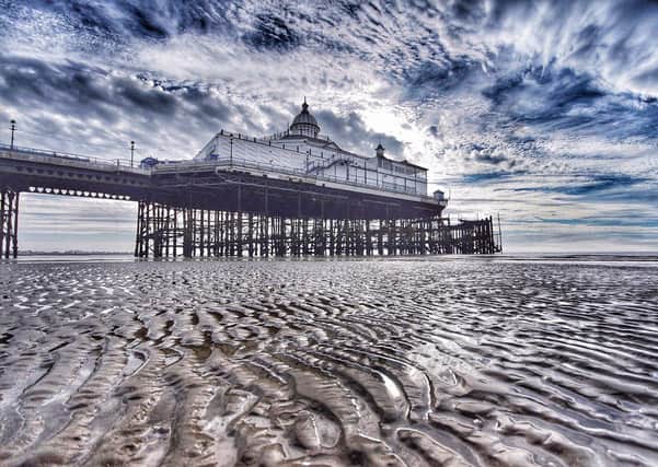 Eastbourne Pier in the early morning, at very low tide. This striking image was taken by Trevor Hall, with a Sony A77, 10-20mm F4 Sigma zoom. This is an HDR image. SUS-200617-110932001