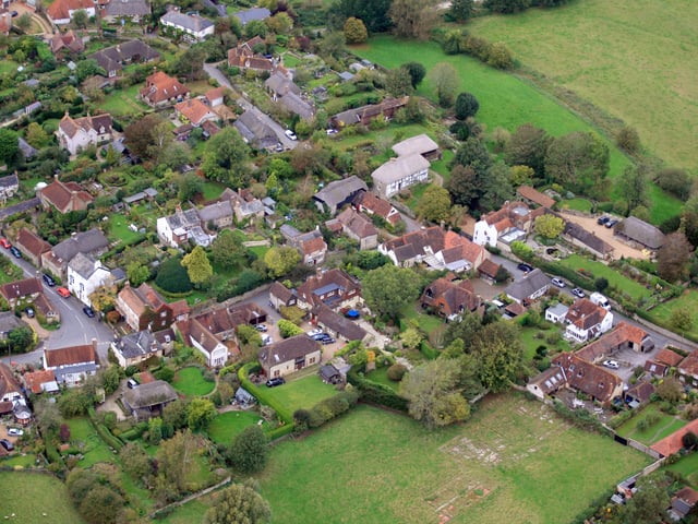 Amberley. The village shop is is just below and to the left of centre. Photo by Derek Martin D11415339a