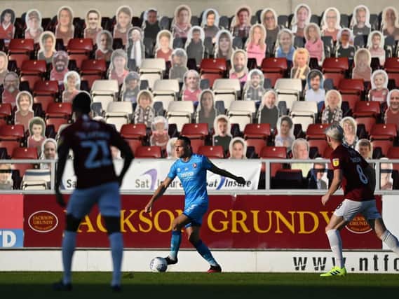 The cardboard cut outs keep a close eye on the action as the Cobblers take on Cheltenham at the PTS on Thursday night (Pictures: Pete Norton)