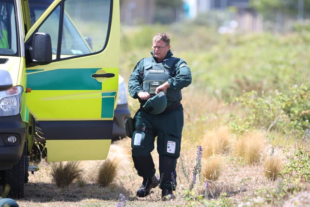 Armed police and emergency crews at the scene in Tasmania Way