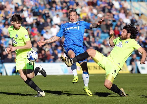 Michael Bostwick (right) and Jack Baldwin (left) in action for Posh.
