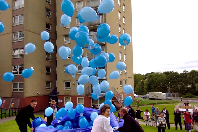 Linda Holman, chairman of the social group, releases the balloons. Picture: Justin Lycett BH26930A