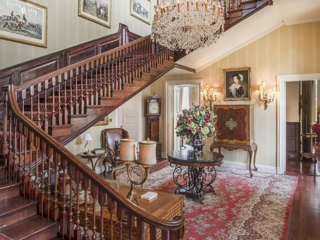One of the grand wooden staircases