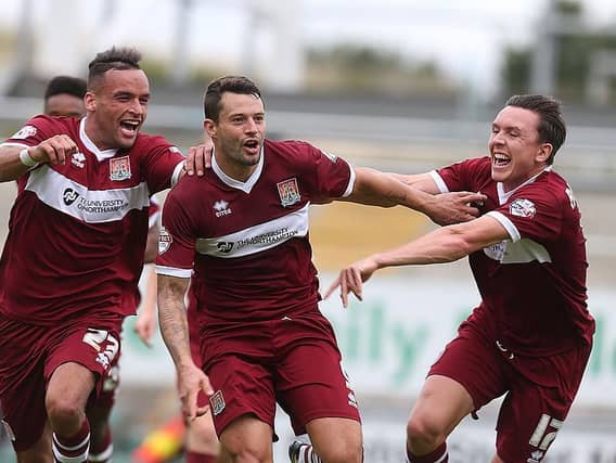 Striker Marc Richards celebrates a last-minute winner for the Cobblers back in 2014