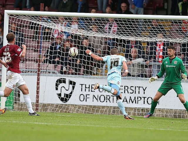 Jacob Blyth fired Town into an early lead, but the Grecians hit back and won it with John O'Flynn's last-minute header (see pic)