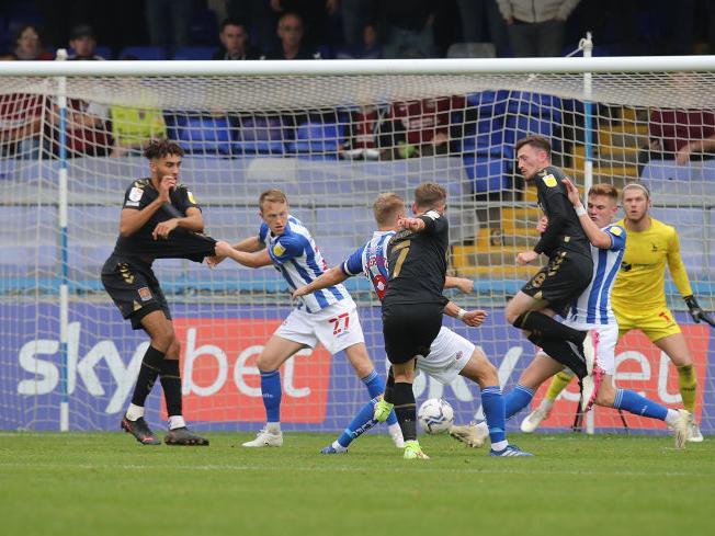 Sam Hoskins sweetly fires Cobblers ahead against Hartlepool. Pictures: Pete Norton.