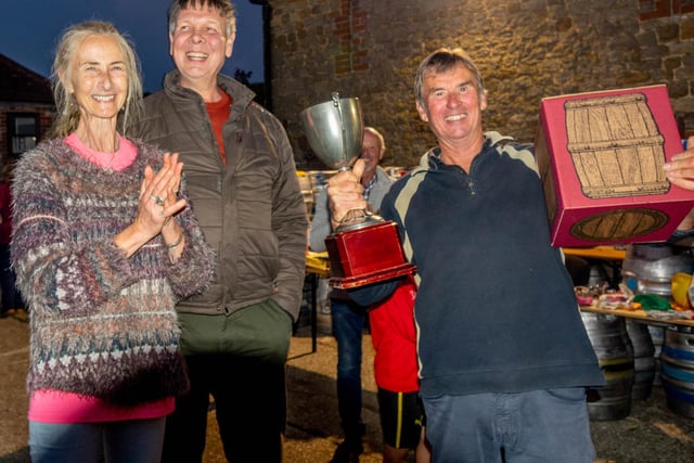 Langham Brewery co-owners, Lesley Foulkes and James Berrow, presenting the winner of the senior championship Peter Hill (right) with his award.