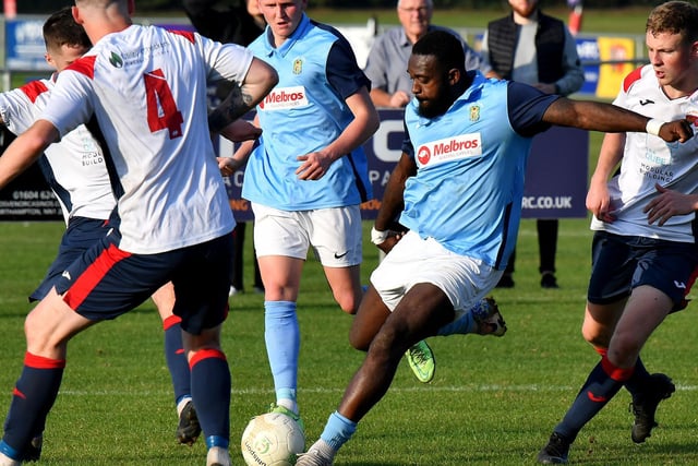 Danico Johnson being triple marked in Rugby Town's 5-2 win