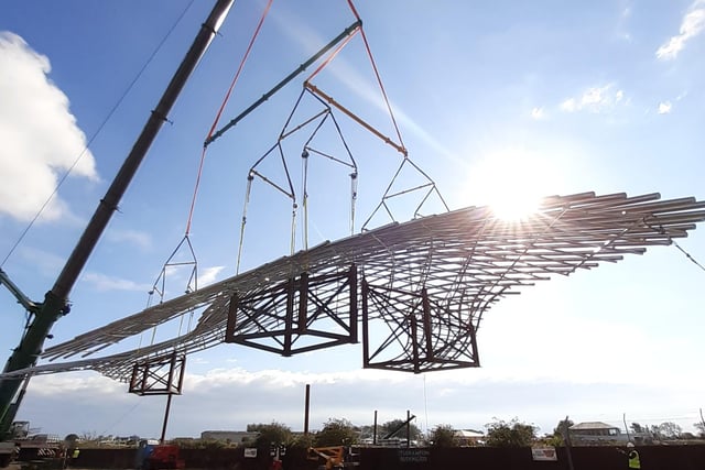 The 36-metre whale sculpture was lifted via crane onto a large ship which will sail the sculpture to Dundee