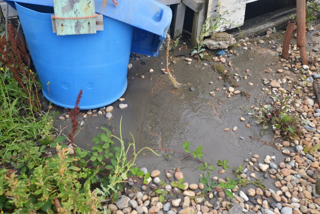 Burst sewage main down Cinque Ports Way, Bulverhythe Beach area, St Leonards. SUS-210730-104655001