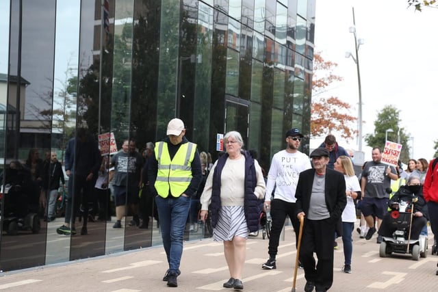 The group, which included local councillors, makes its way to the Corby Cube.