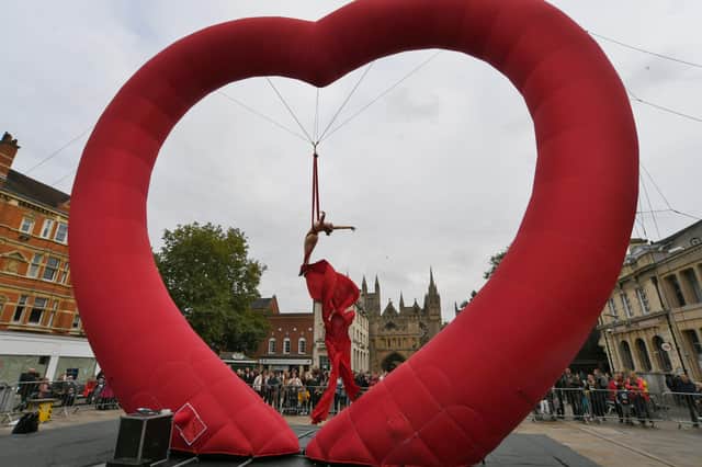 The Dream Engine Love Art heart with performer Nicky Pearson on Cathedral Square EMN-211017-192115009