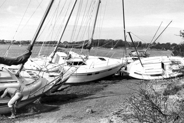Boats washed up to dry land at Chichester Harbour