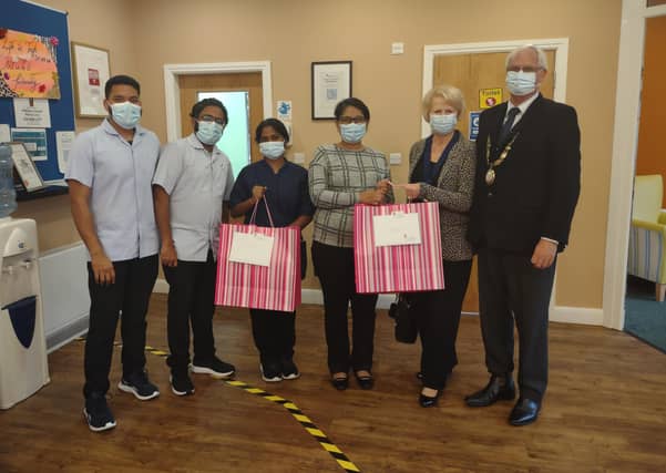 Haywards Heath town mayor Howard Mundin and Margaret Baker delivered treat bags to care homes for Silver Sunday. Picture: Haywards Heath Town Council.