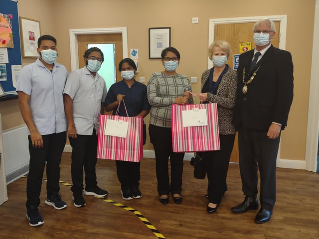 Haywards Heath town mayor Howard Mundin and his consort Margaret Baker delivered treat bags to every care home in town for Silver Sunday. Picture: Haywards Heath Town Council.