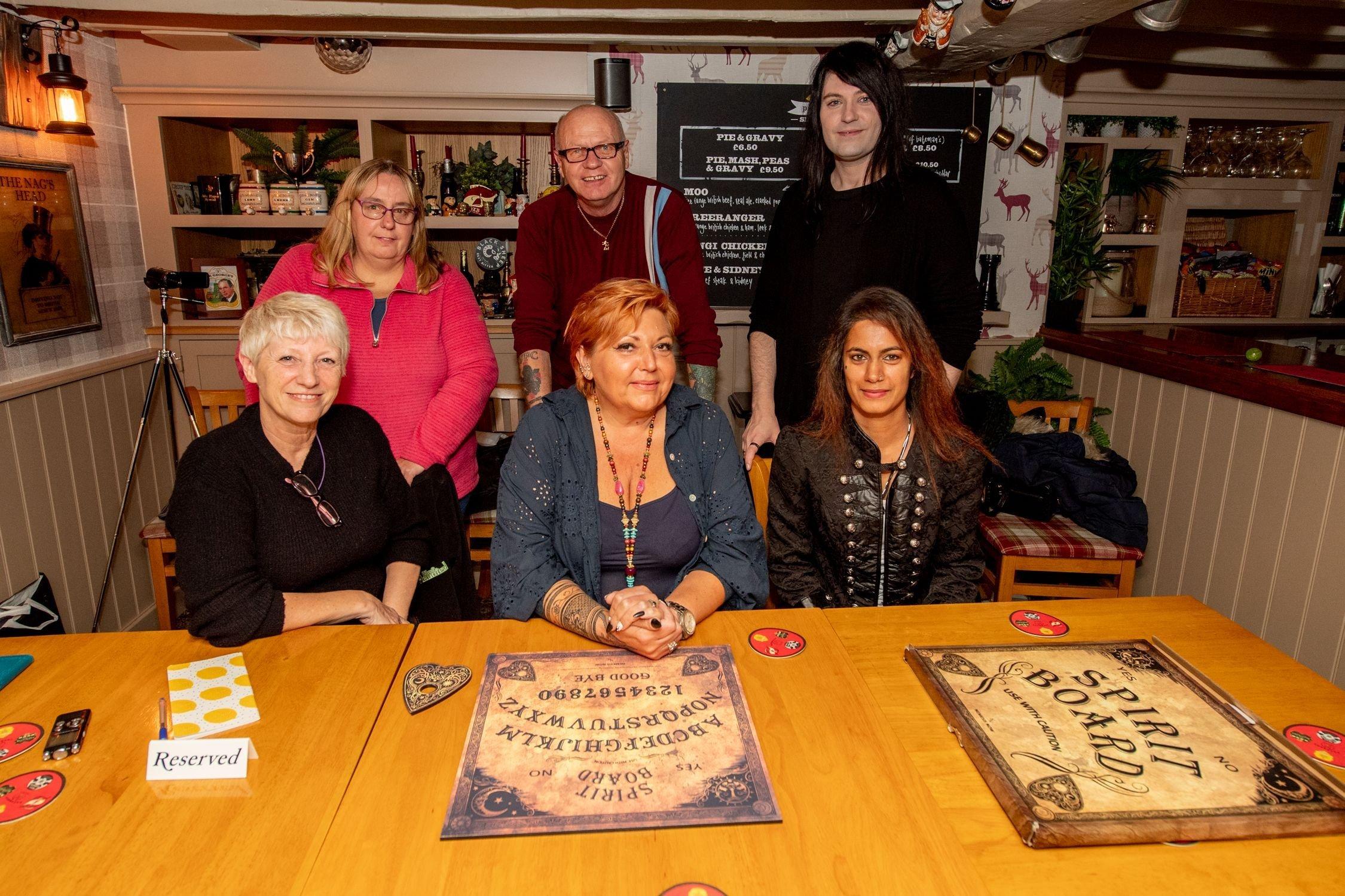 The guests get ready for a paranormal investigation at the Thatch pub. EMN-211021-122655001
