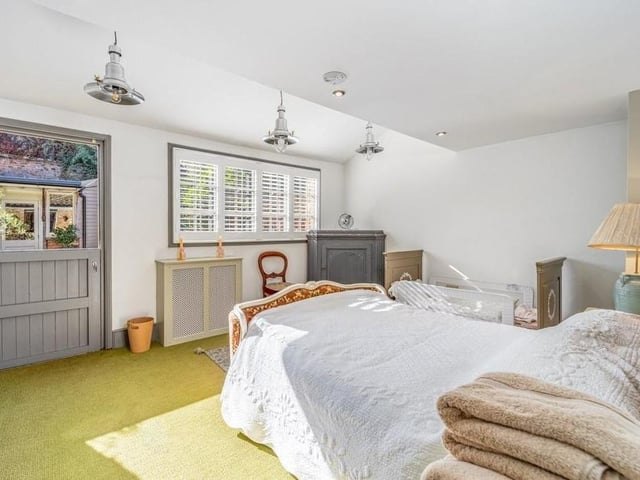 One of the two bedrooms, with a door leading to the courtyard.