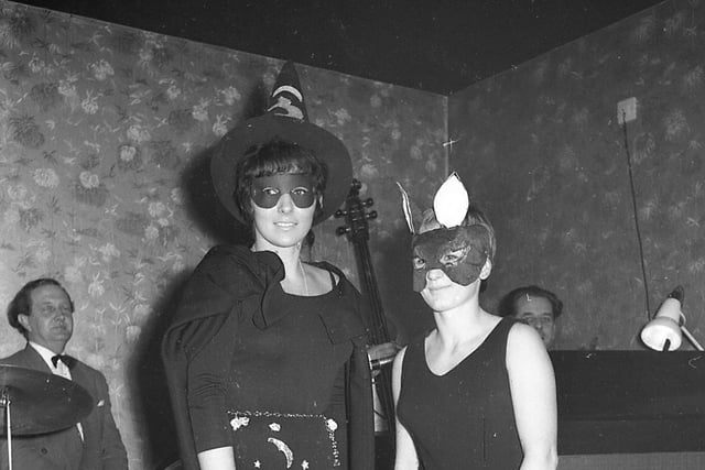 Witch Pam Storey and cat Paula Todd at the Boston Cabaret Club Halloween party in 1966.