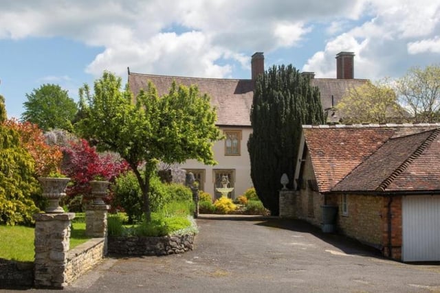 This shot shows the private parking at the property and also the two-bed cottage which is adjacent to the main tower home.