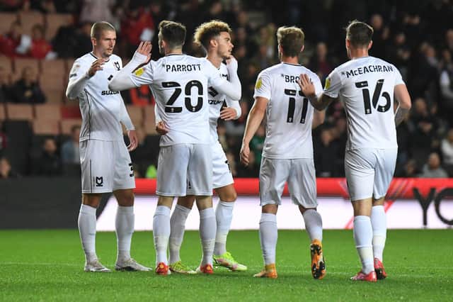 MK Dons celebrate Troy Parrott's first half equaliser against Aston Villa U21s