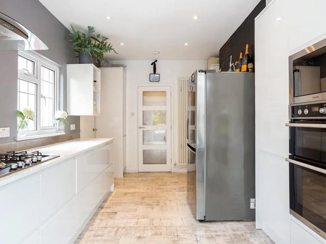 The kitchen boasts has many integrated appliances, like a double oven, a microwave and a dishwasher. Picture: Hamptons - Haywards Heath Sales.