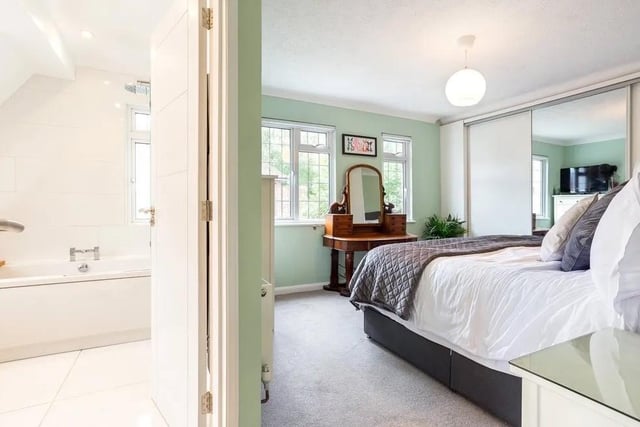The main bedroom has extensive built-in storage and a contemporary en suite bathroom. Picture: Hamptons - Haywards Heath Sales.