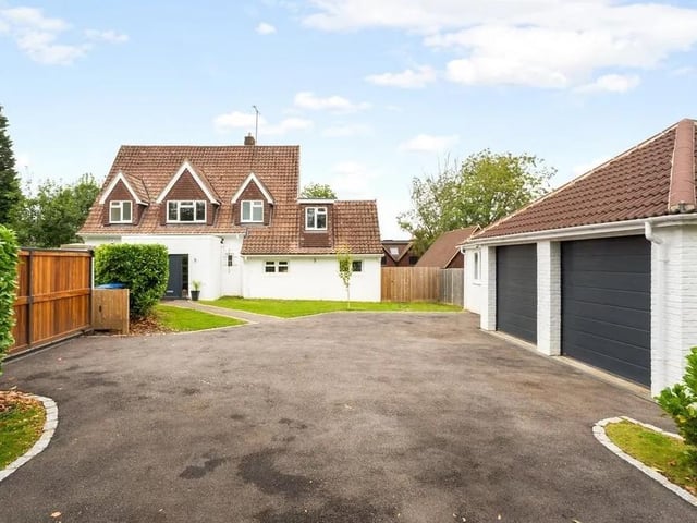 The front of the property has a gated driveway that offers private parking for several cars. Picture: Hamptons - Haywards Heath Sales.