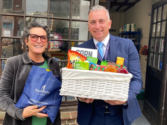 Big-hearted residents and staff at a Hailsham care home have handed over delicious goodies to Hailsham Foodbank. The donation by Abbots Wood Manor Care Home, London Road, was organised by staff and residents as part of their community outreach programme. Pictured here are Abbots Wood Manor wellbeing and lifestyle coach Kay Griffett and Richard Hollands, regional community relations lead with some of the items donated to Hailsham Foodbank. SUS-211029-105716001
