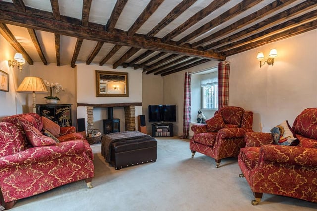 The living room inside St Patrick's grade II listed cottage on the market in the village of Aynho near Banbury (Image from Rightmove)