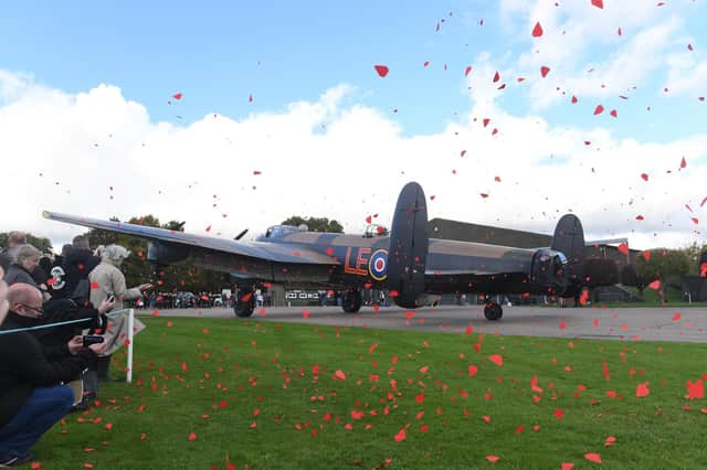 Petals dancing in the breeze after being released from the Just Jane Lancaster at the Lincolnshire Aviation Centre in East Kirkby.