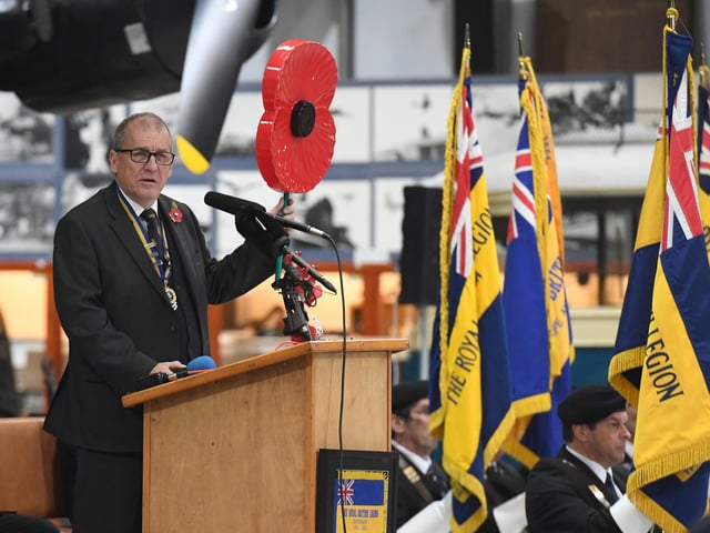 John Johnson, Lincolnshire County Chairman, welcoming guests to the launch of the Royal British Legion Poppy Appeal in the shadow of the WW2 Lancaster bomber.